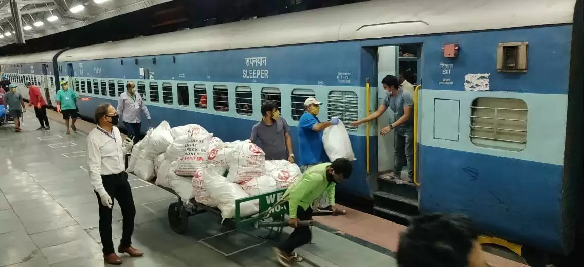 Passengers served with snack packets as they leave Pune on trains