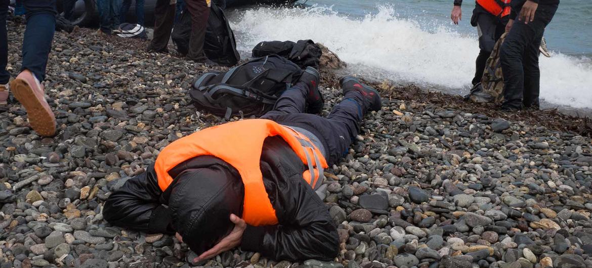 Volunteers help refugees arriving on the island of Lesbos, in the North Aegean region of Greece. (file)