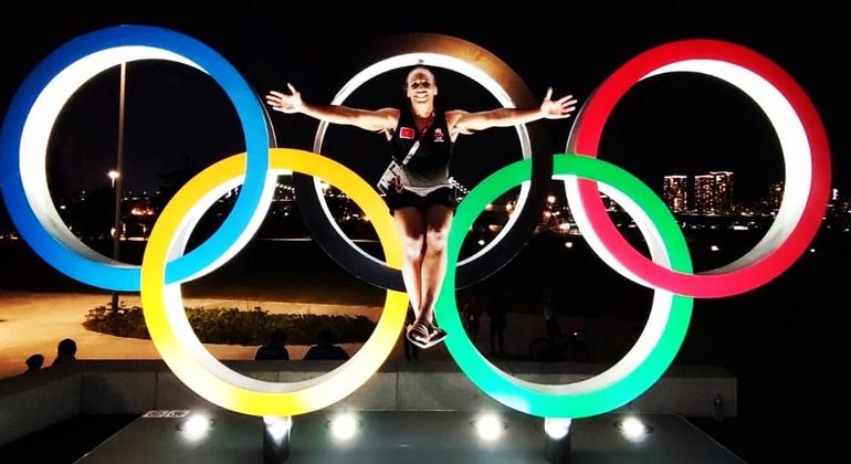 Asmaa Niang poses on the Olympic rings at the Tokyo Olympic Games in 2020.